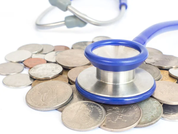 Stethoscope and coins — Stock Photo, Image