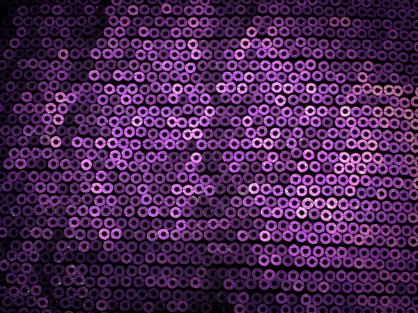 Violet sequins embroidered on black fabric — Stock Photo, Image