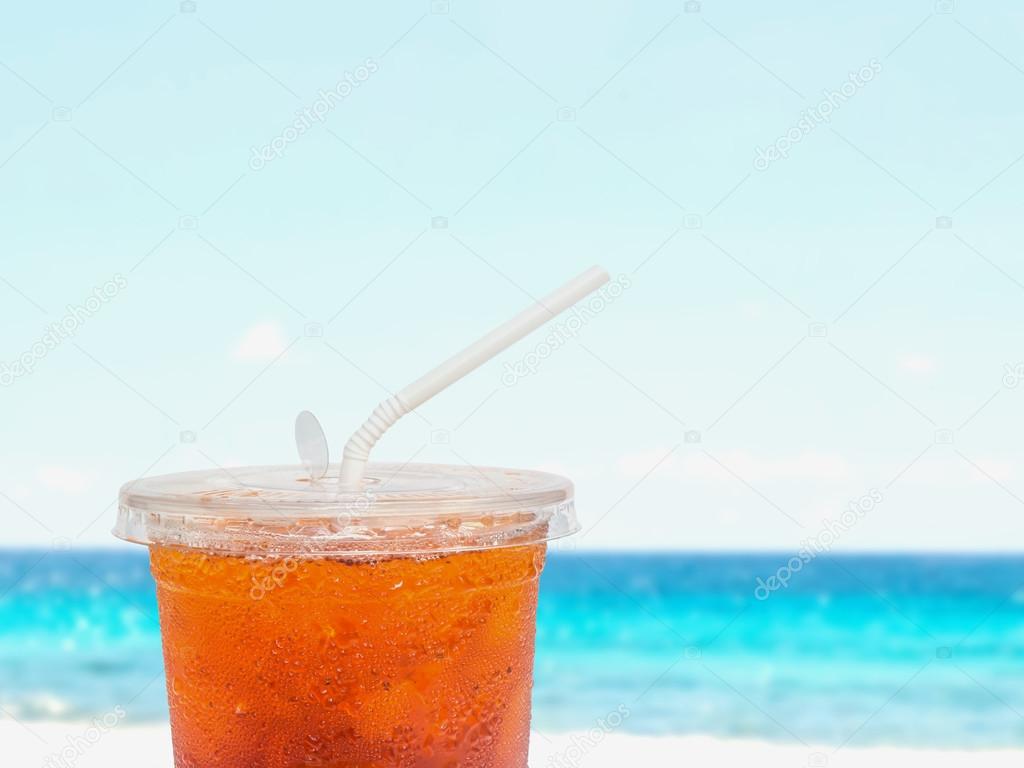 Close up ice tea in plastic disposable cup 