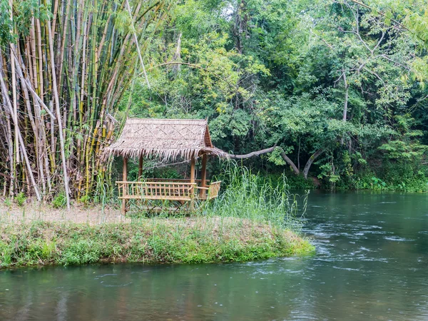 Bamboo hut near the river — Stock Photo, Image