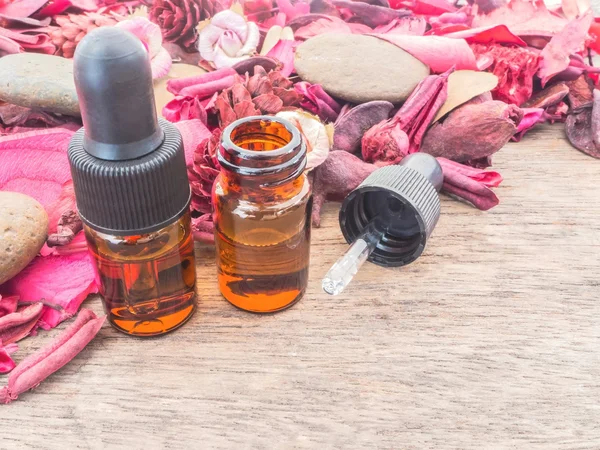 Dropper bottle with red potpourri — Stock Photo, Image