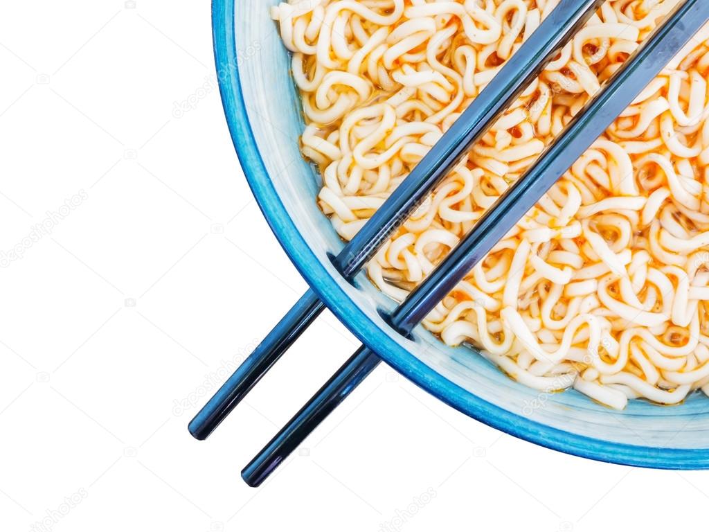 spicy instant noodles in bowl with chopsticks
