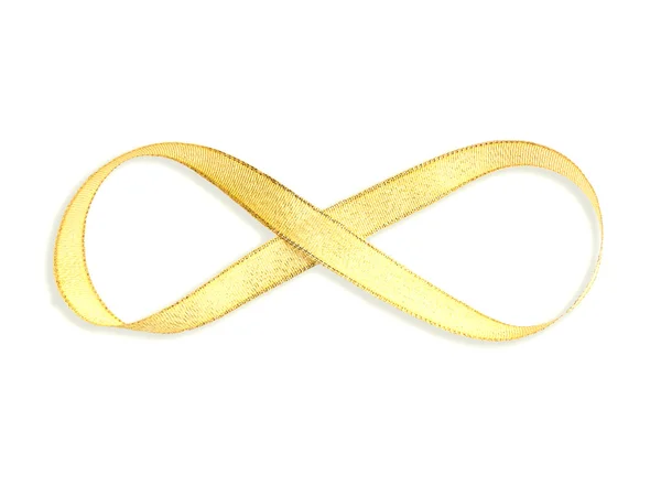 無限の形をしたゴールドのサテンリボン — ストック写真