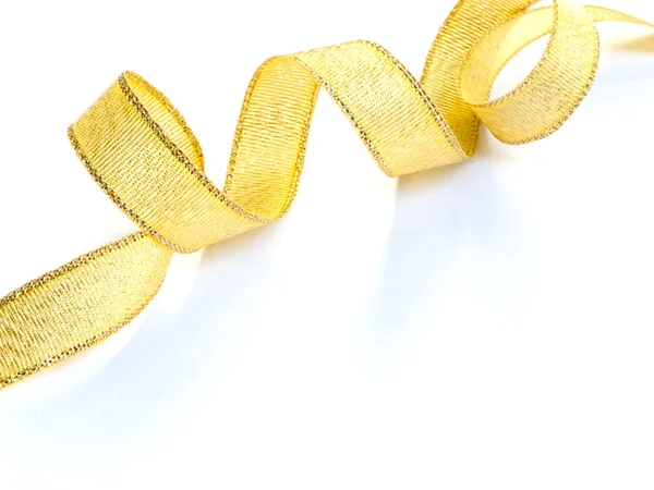 Zakřivené zlatá saténová stuha — Stock fotografie
