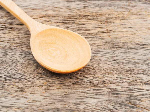 Wooden spoons on wood background — Stock Photo, Image