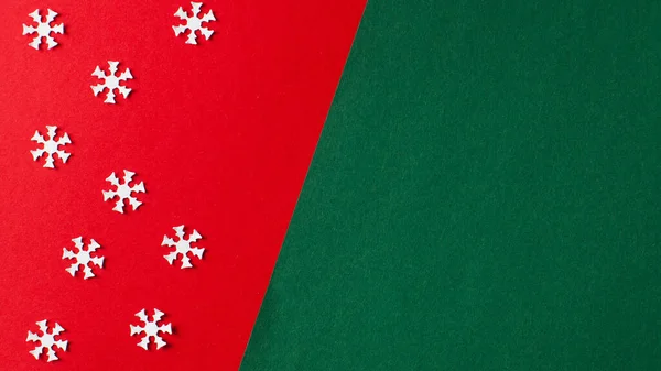 Christmas background, new year red and green background with white snowflakes. Copy space.