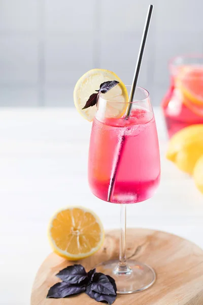 Refreshing summer drink in a glass, red basil lemonade. — Stock Photo, Image