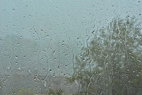 Gotas de chuva no vidro da janela . — Fotografia de Stock