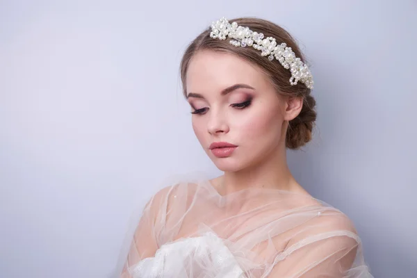 Beautiful woman  bride with tiara on head  on bright background , copy space — Stock Photo, Image