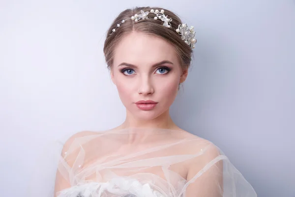 Beautiful woman  bride with tiara on head  on bright background , copy space — Stock Photo, Image