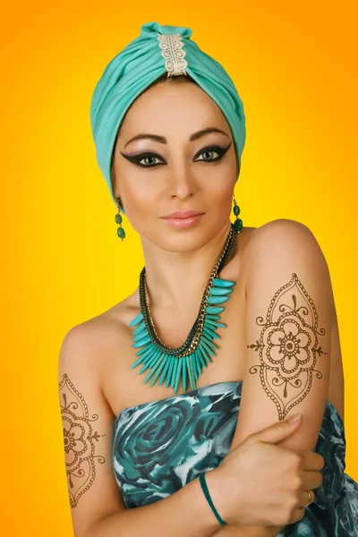 Beautiful woman in oriental style in turban — Stock Photo, Image