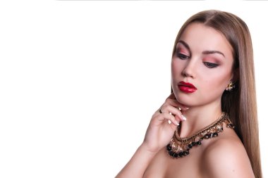 Closeup portrait of a beautiful girl with a black and gold necklace around her neck. Isolated over white background. Copy space.
