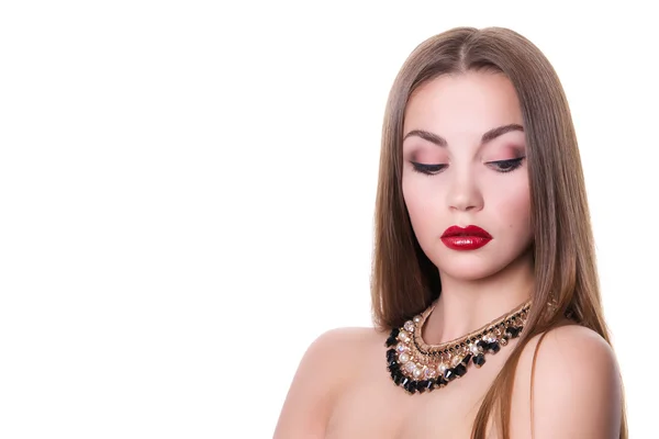 Closeup portrait of a beautiful girl with a black and gold necklace around her neck. Isolated over white background. Copy space. — Stockfoto