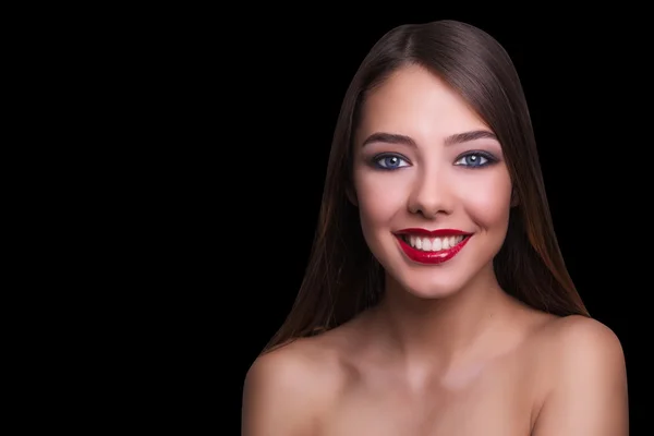 Close portrait of a beautiful girl with a red lips and smoky eyes. Isolated on black background. Copy space. — Stock Photo, Image