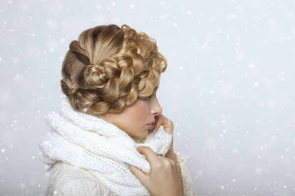 portrait of a beautiful young blonde woman on a light background.