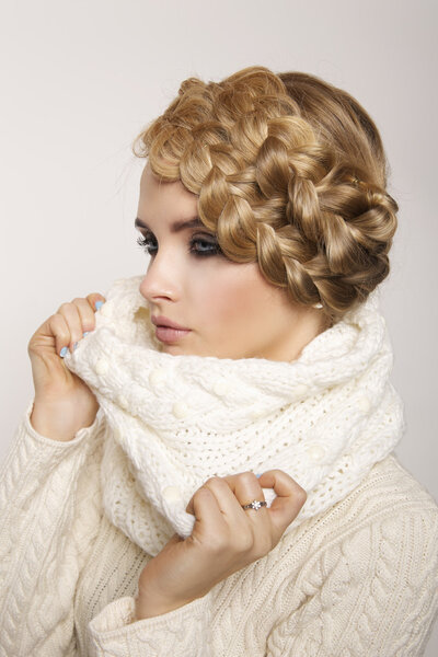 portrait of a beautiful young blonde woman on a light background.