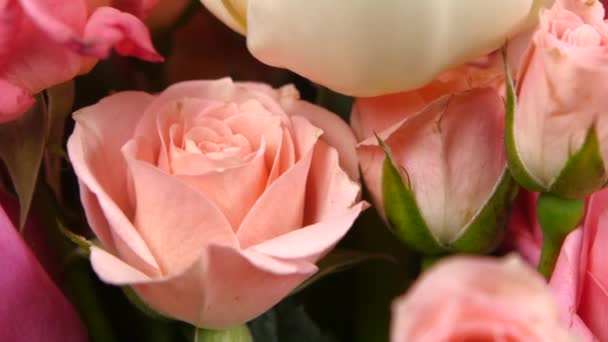 Top of bouquet flower with roses and tulips, on yellow, rotation, close up — Stock Video