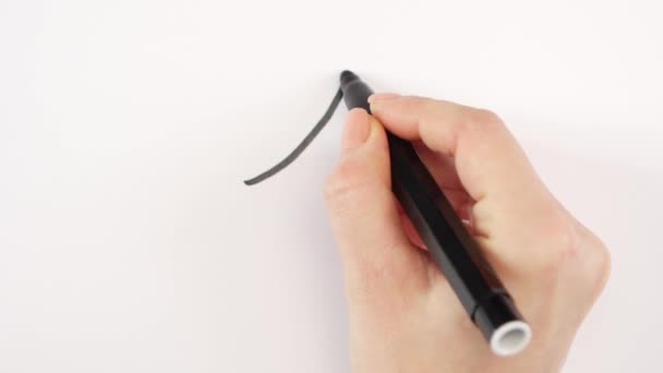 Mão de mulher escrevendo objetivo 1, um no papel — Vídeo de Stock