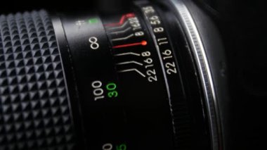 Wheel on camera aperture, change focus, up view, close up