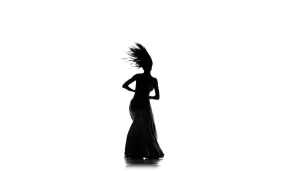 Talanted exotic belly dancer woman go on dance, on white, slow motion, silhouette — Stock Video