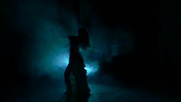 Talanted exotic belly dancer woman, shaking her hips, on black, slow motion, silhouette, smoke — Stock Video