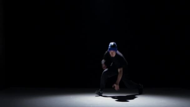 Boy dancing breakdance, on black, shadow — Stock Video