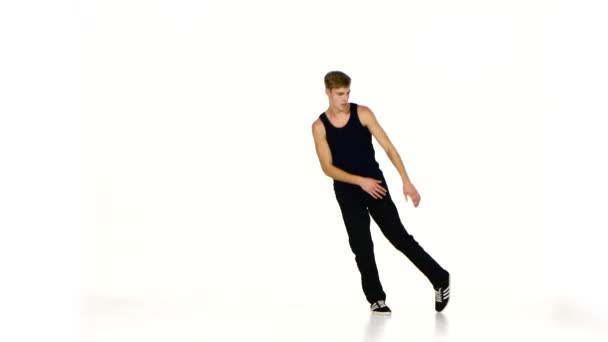Young blonde dancer man dancing breakdance on white — Stock videók