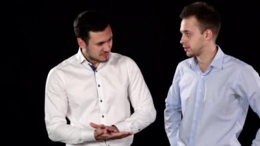 Two gyus with winning player getting his chips. Black