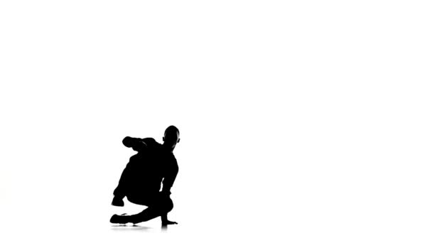 Dancer man dancing breakdance moves, white, silhouette, slow motion — Stock Video