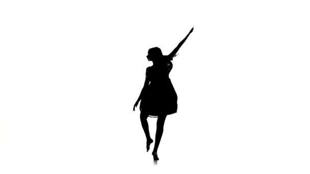 Graceful girl dancer dancing contemporary dance on white, silhouette, slow motion — Stock videók