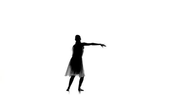 Beautiful woman in light dress dance modern contemporary style on white, silhouette, slow motion — Wideo stockowe