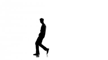 Young man dancing breakdance on one hand, white, silhouette, slow motion