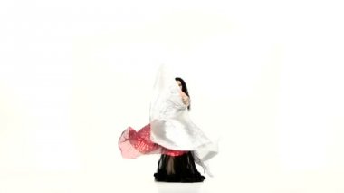 Young exotic belly dancer with two wings, shaking her hips, on white, slow motion