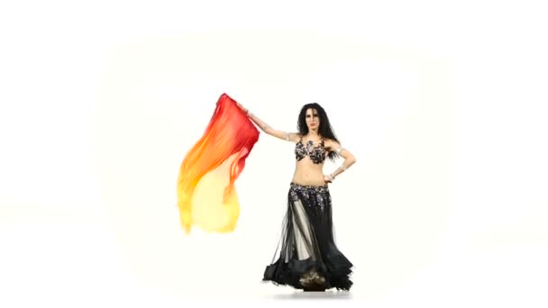 Talanted belly dancer girl dance with long fans, shaking her hips, on white, slow motion — Stock Video