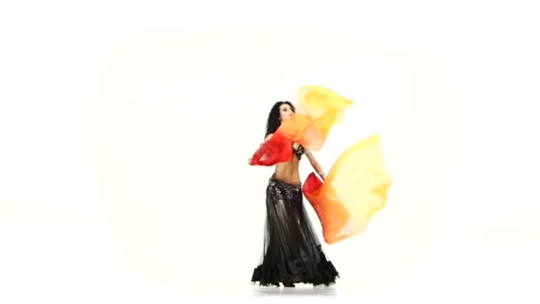 Belly dancer girl dance with long fans, wave her hair, shaking her hips, on white, slow motion — Stock Video
