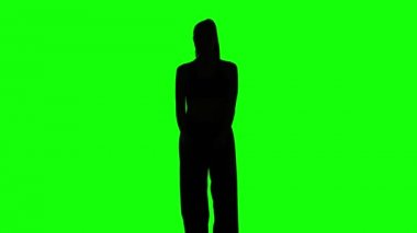 Young girl shows different elements karate. Green. Silhouette