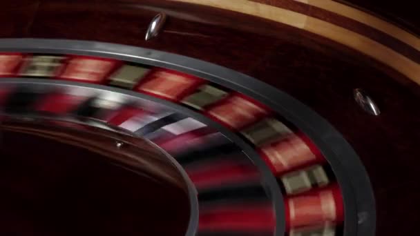 Roulette wheel fast running, white ball falls — Stock Video