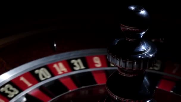 Roulette wheel running and stops with white ball on 20 — Stock Video