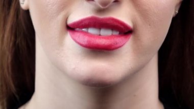 Woman smile with great teeth and red lips. Closeup