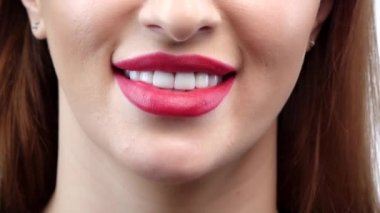 Woman smile. Teeth whitening. Dental care. Close up. Slow motion