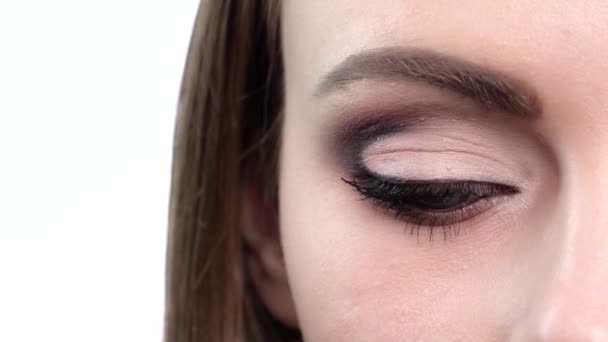 Woman eye with bright makeup. Close up. Slow motion — Wideo stockowe