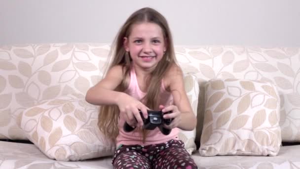 Child playing video game on tv in morning, slowmotion — Stock Video