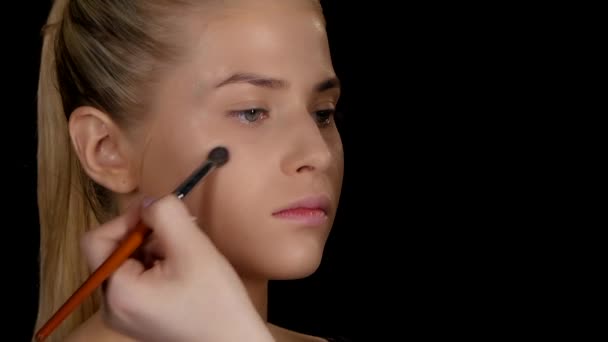 Applying highlighter. Makeup. Black. Closeup — Stock Video