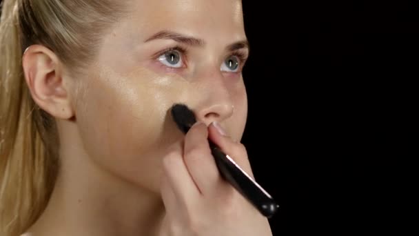 Makeup. Applying foundation. Black. Closeup — Stock Video