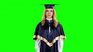 Mezun tehdit parmak ve sessizce işareti gösterir. Yeşil ekran