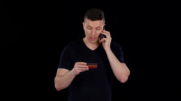 Man does buy by online with his credit card. Black — Stock Video