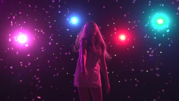 Silhouette of dancing girl with disco style lights. Slow motion — Stock Video