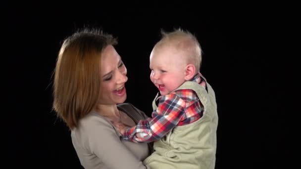 Mother with newborn baby. Black. Close up — Stock Video