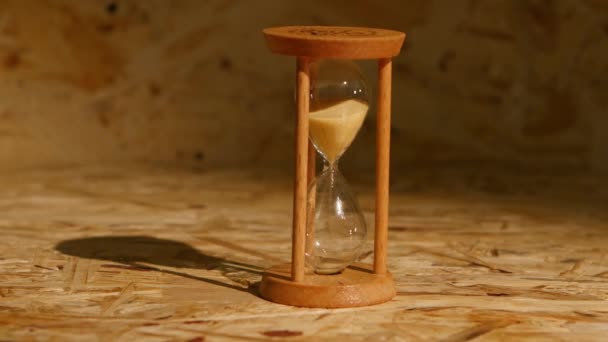 Sand falls quickly through an hourglass — Stock Video