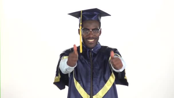 Graduation in glasses showing thumbs. White. Slow motion. Close up — Stock Video